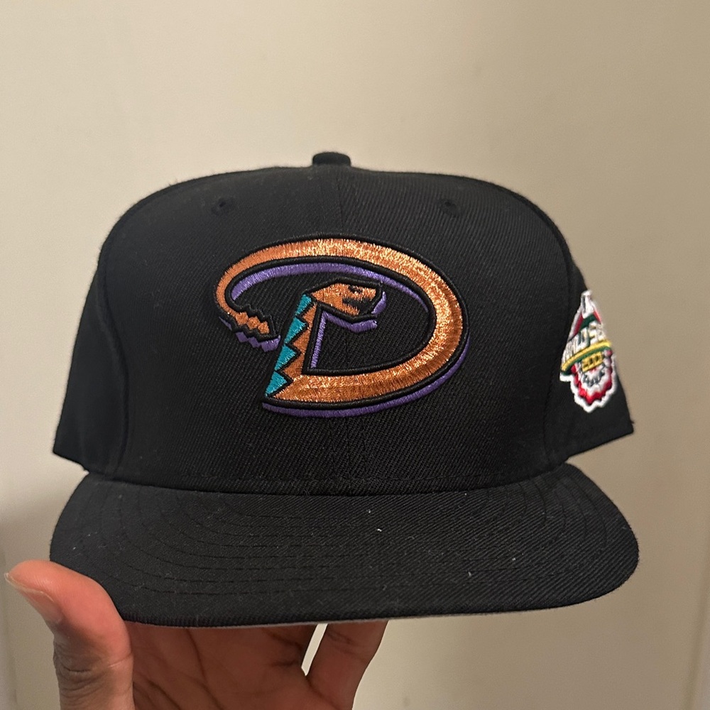 New Era Black Hat with Orange and Purple Logo
